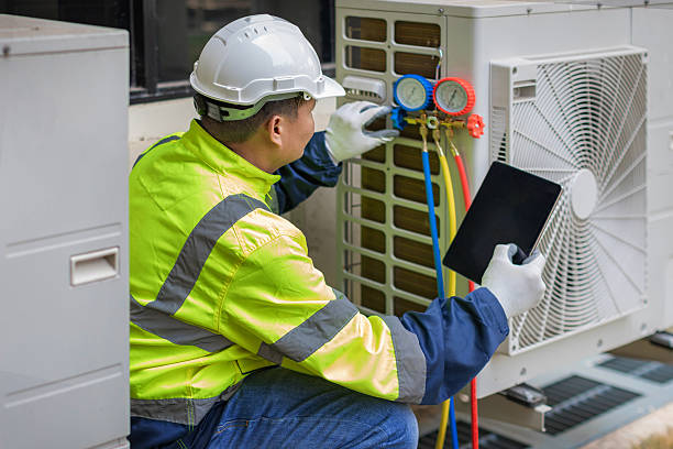 Professional Heat Pump Repair technician working in Trinway, OH